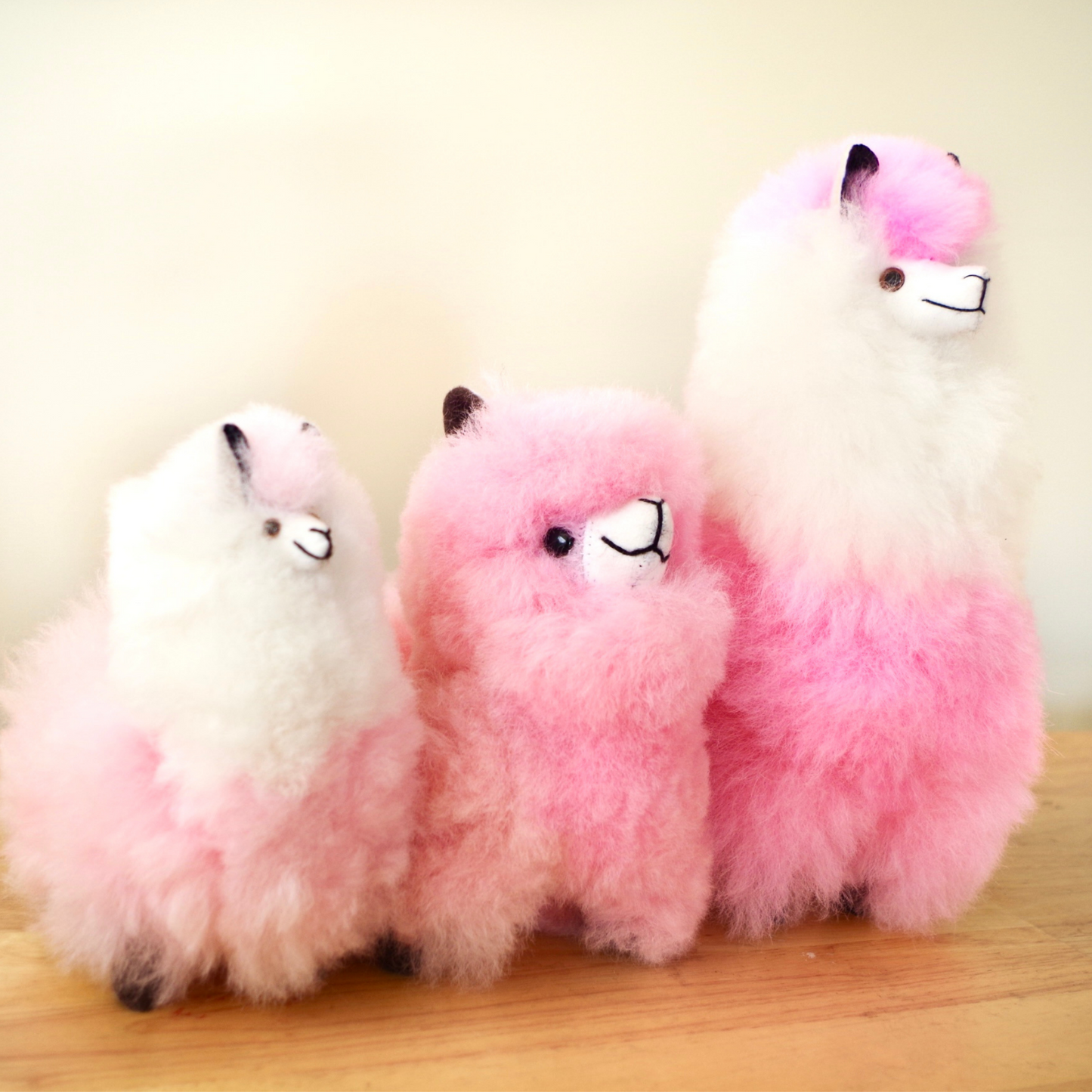 Home decor or gift soft llama plushy Pink in different sizes. 100% alpaca wool. Made by Bolivian and Peruvian artisans. Sizes: 8 x 8 in