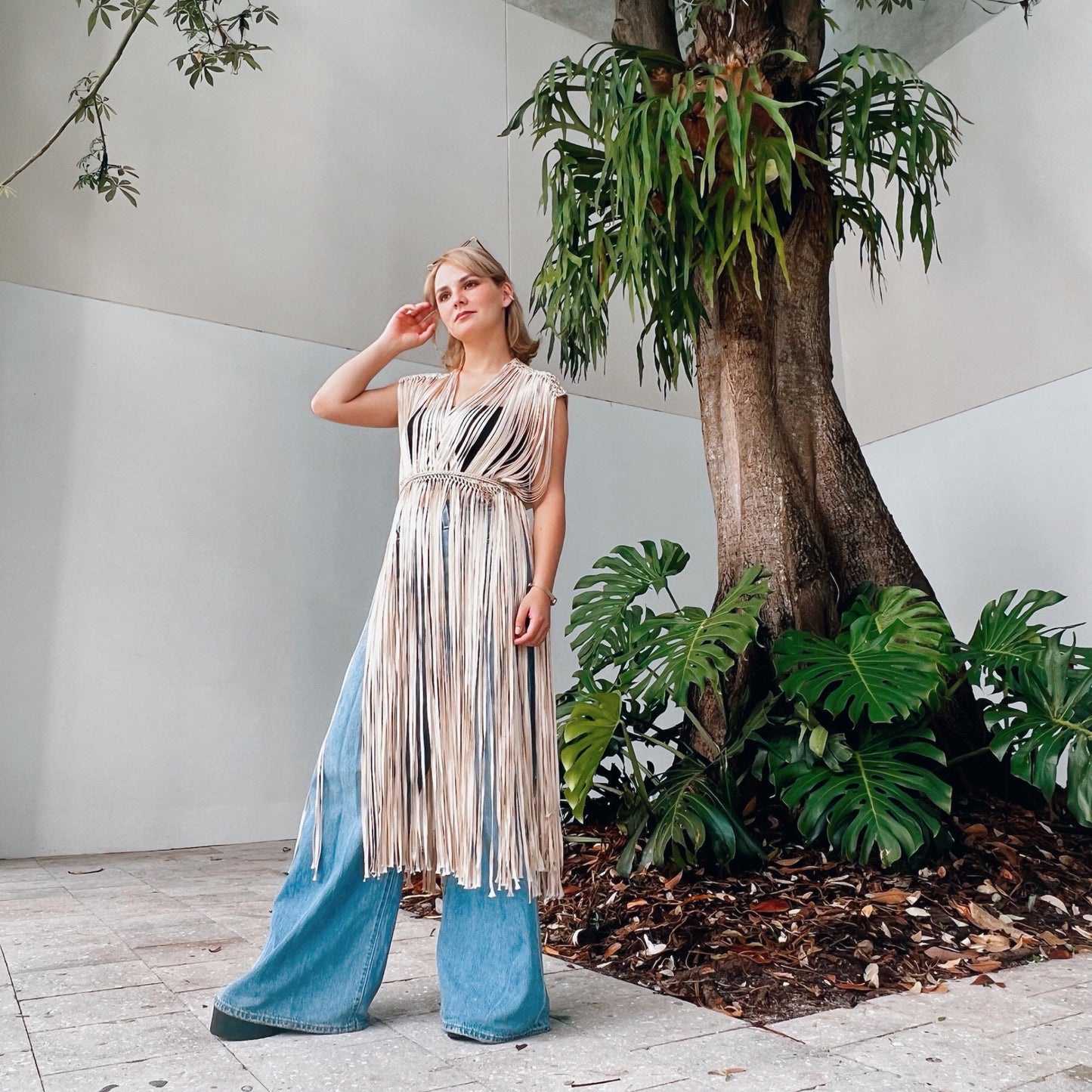 Macrame accessory for festival or beach vacation. Wrap tie closure at shoulders and waist. Care instructions: Steam to straighten any wrinkles. Ethically made by Bolivian Artisans. 100% Rayon. Colors available: Beige, Black, Gold.