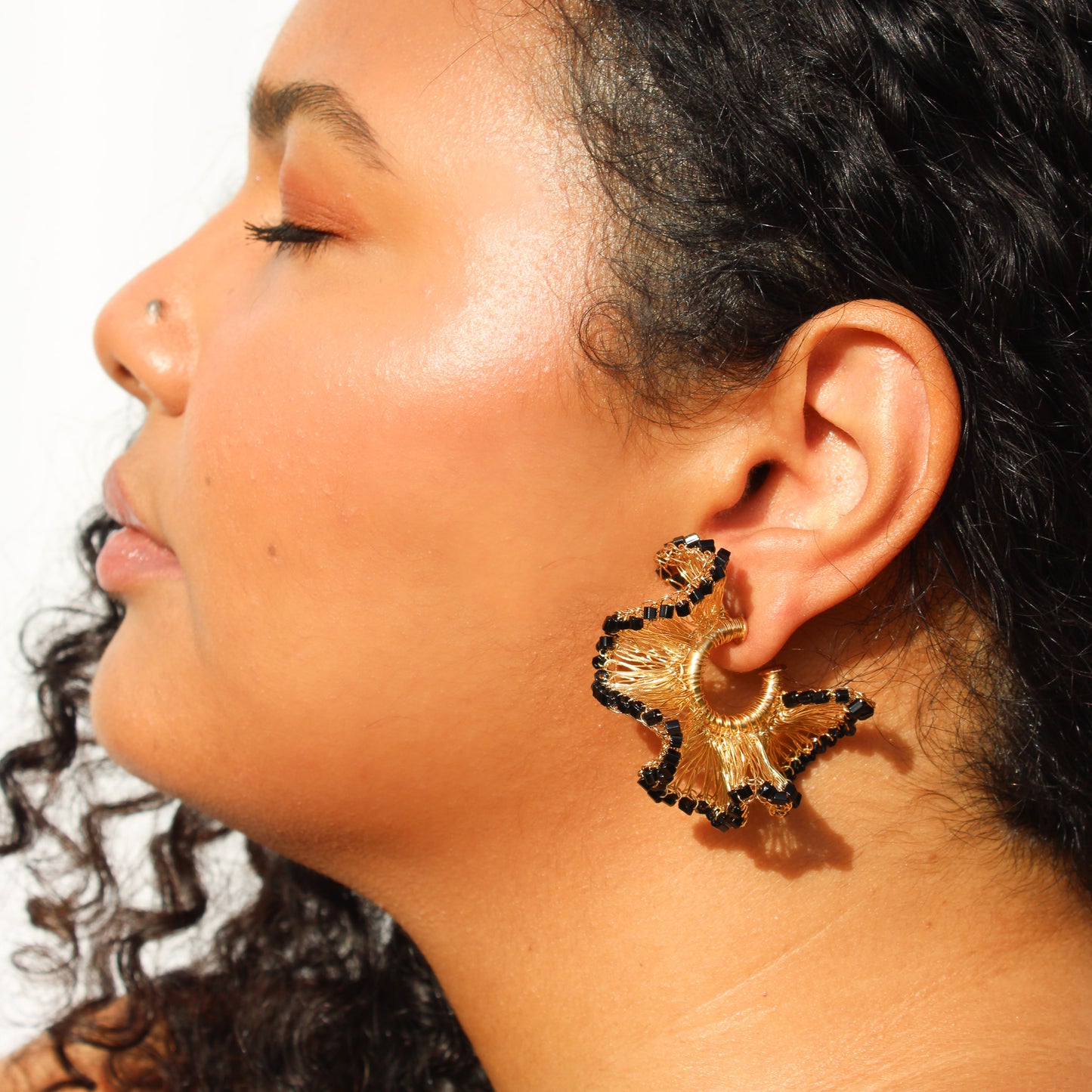 Lightweight ruffled crochet hoops, Black beads and 18 karat gold filled copper wire and create a statement look without the weight or bulk!