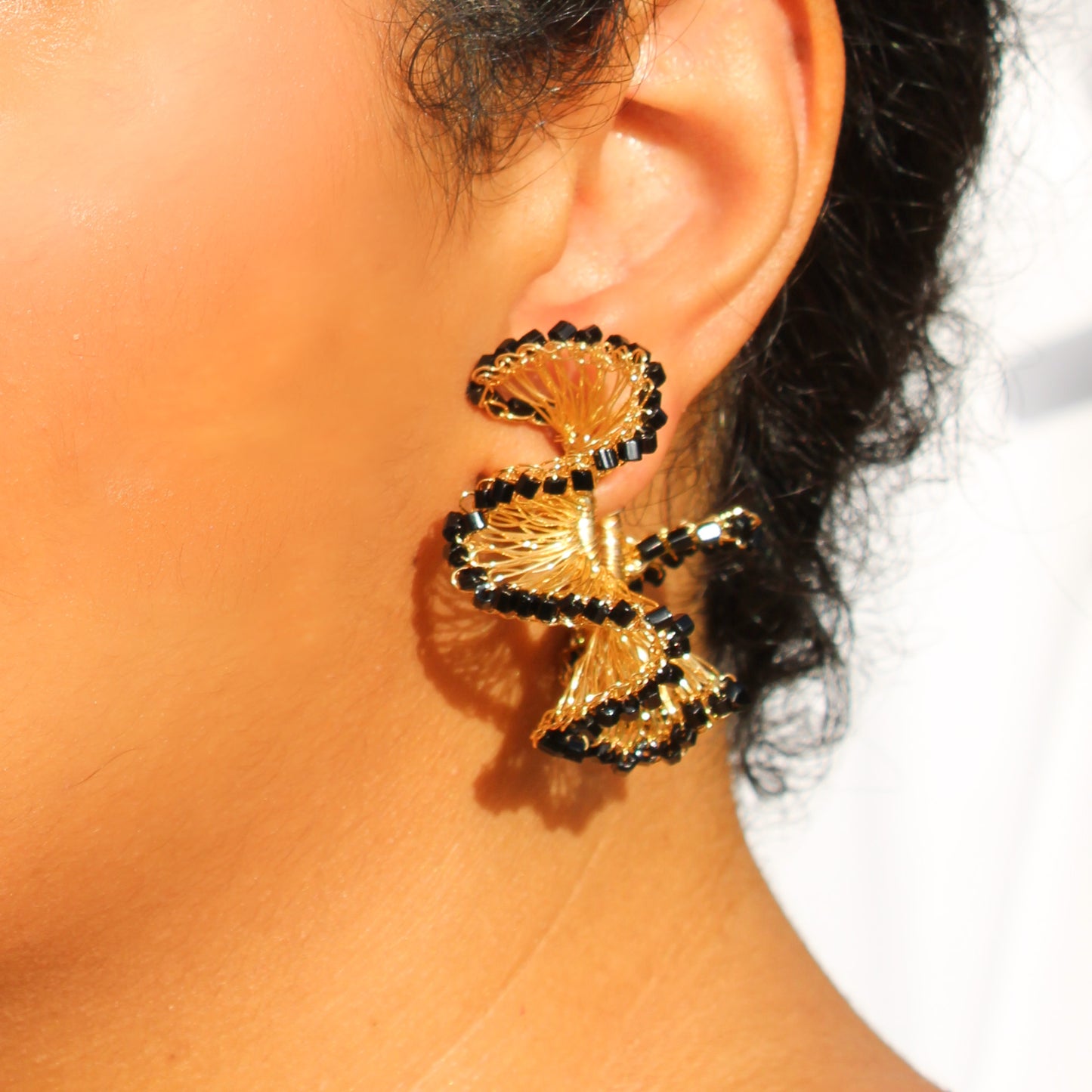 Lightweight ruffled crochet hoops, Black beads and 18 karat gold filled copper wire and create a statement look without the weight or bulk!