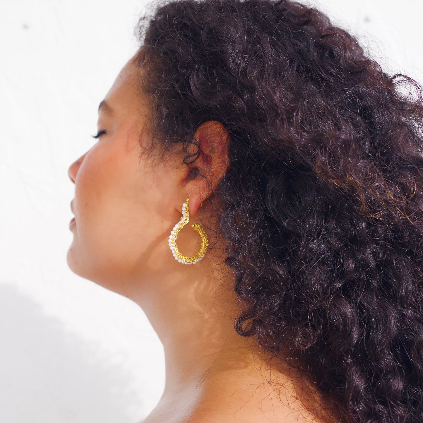 Crochet beaded geometric hoop earrings. 18 karat gold filled copper wire. Super lightweight earrings with white beads