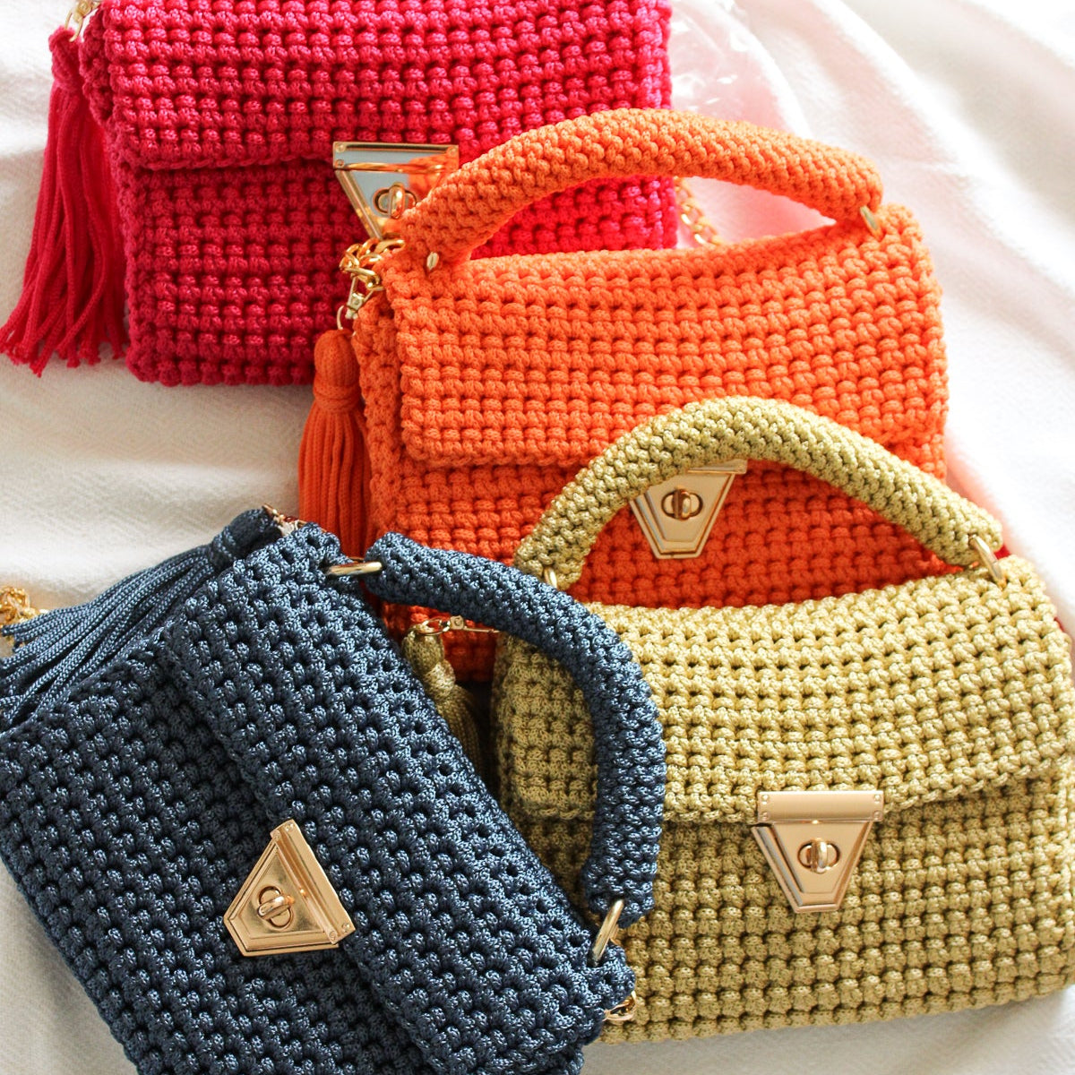 Handmade vivid colorful bags. Crochet textured purses with gold closures and chains for a crossbody look