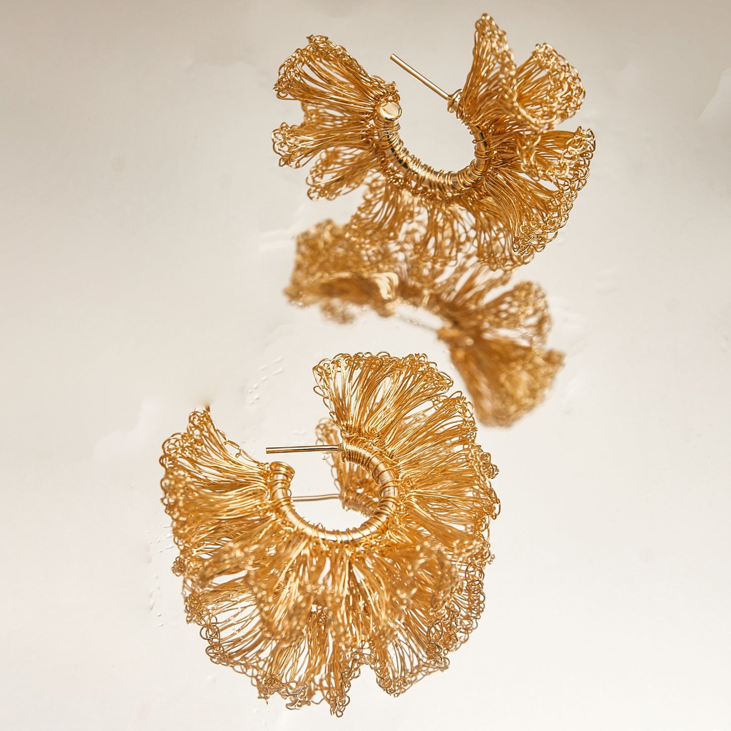 Lightweight ruffled crochet hoops, 18 karat gold filled copper wire and create a statement look without the weight or bulk!