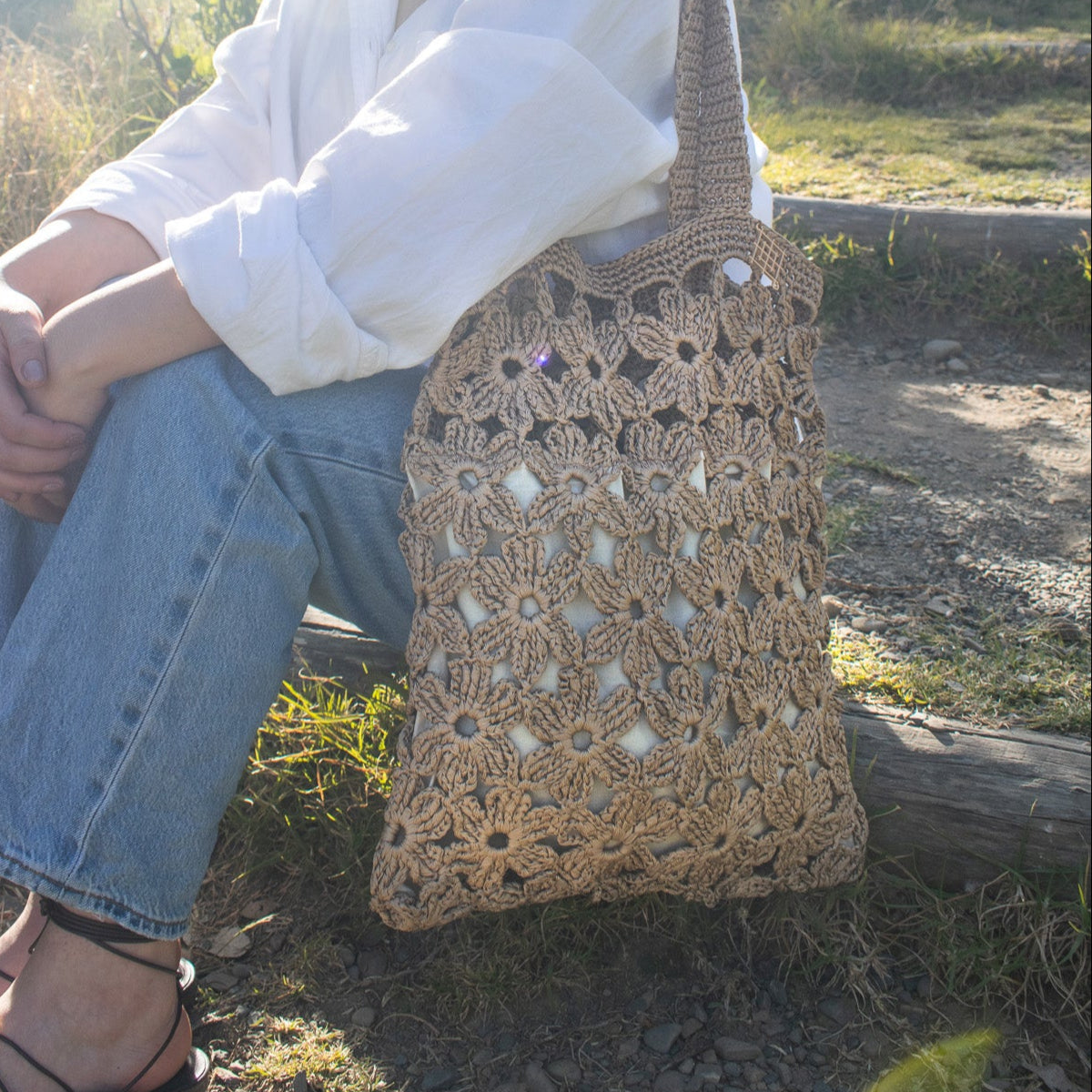 Handmade crochet flower tote bag in beige. This handmade tote bag features soft interior lining and pocket. each bag has over 40 crochet flowers and has lots of space to fit your stuff, like phone, wallet, glasses, make up bag, hat, etc. Perfect classy handmade tote bag in beige