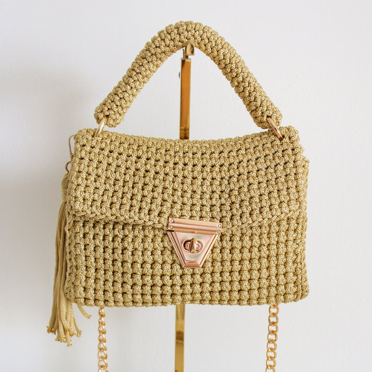 Handmade crochet lime green amber bag. Textured crochet lime green bag with gold detailing and gold chain for crossbody look.