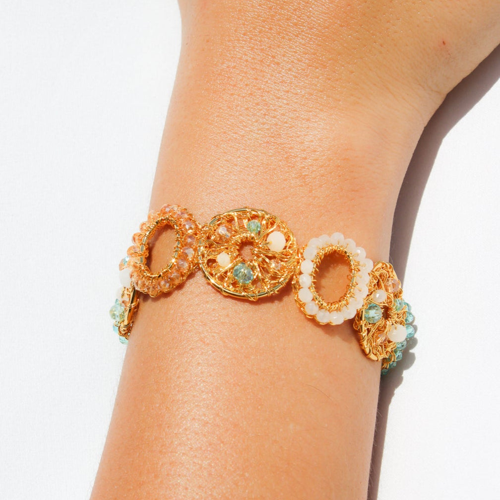 This unique handmade gold bracelet is the perfect way to add a pop of shimmer to your outfits. With pearls, crystal beads and gold wire. Multilayered handmade beautiful bracelet for woman.