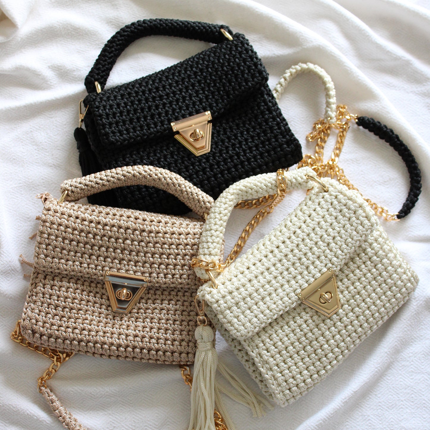 Handmade textured crochet purses. Neutral tone handbag made by hand. Pearl, beige and black handbags with gold detailing and gold chain for crossbody and shoulder look