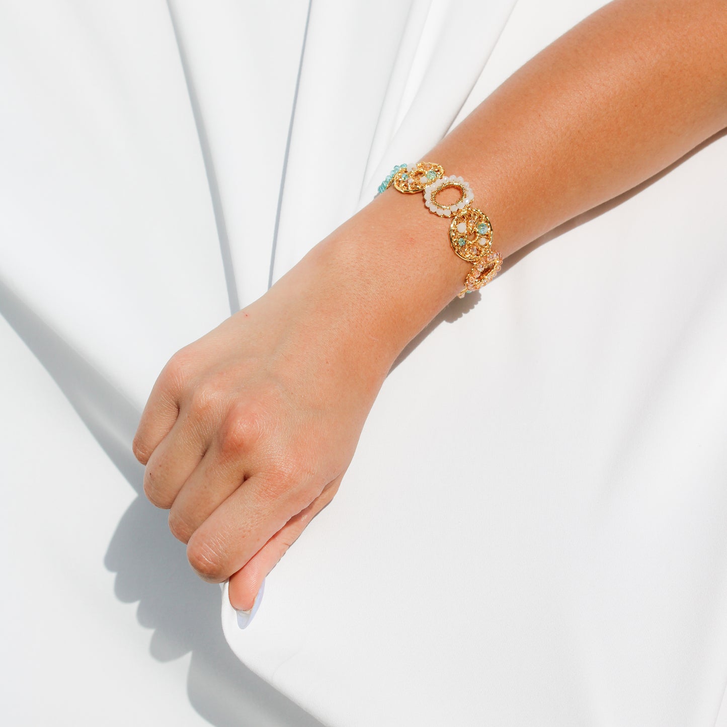 This unique handmade gold bracelet is the perfect way to add a pop of shimmer to your outfits. With pearls, crystal beads and gold wire. Multilayered handmade beautiful bracelet for woman.