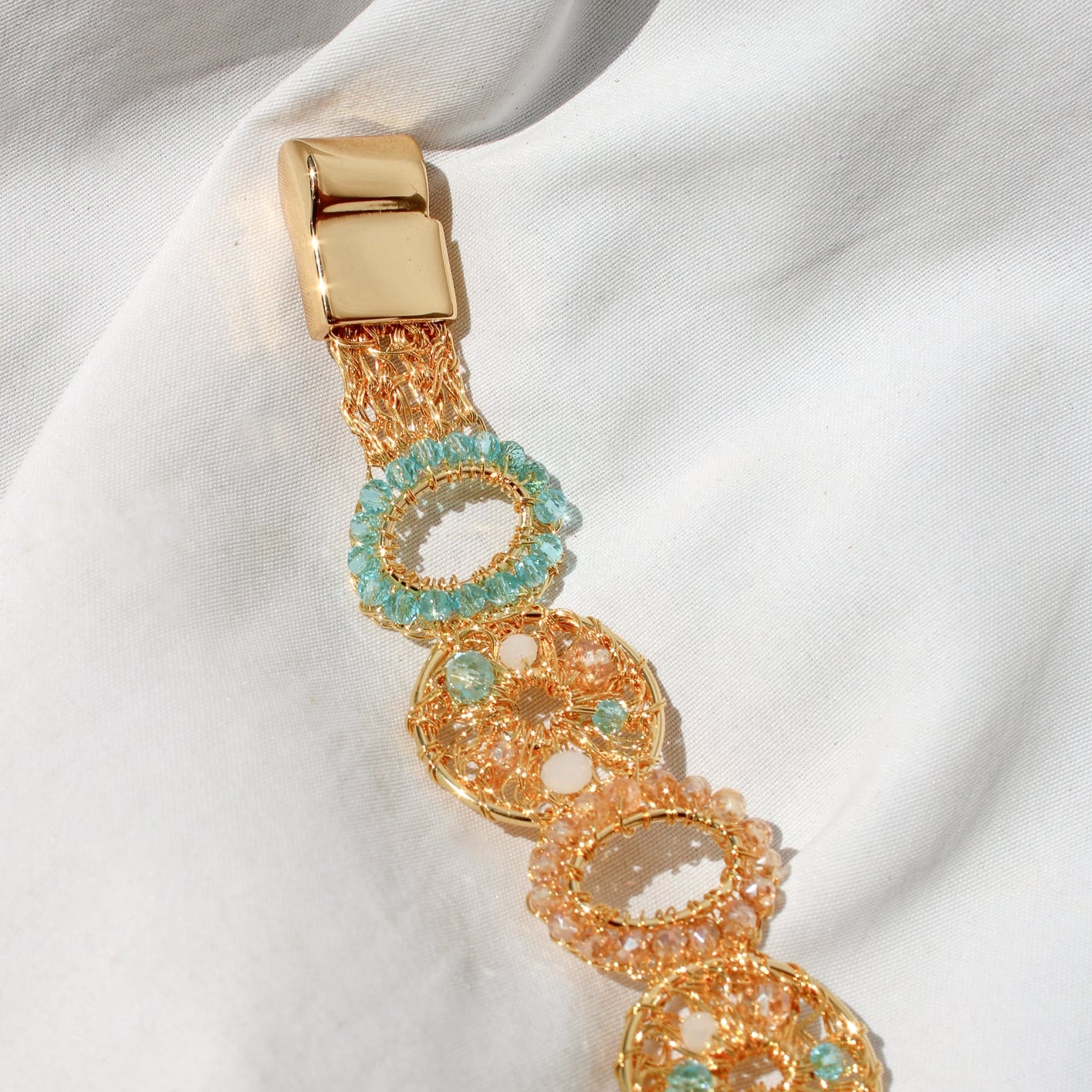 This unique handmade gold bracelet is the perfect way to add a pop of shimmer to your outfits. With pearls, crystal beads and gold wire. Multilayered handmade beautiful bracelet for woman.