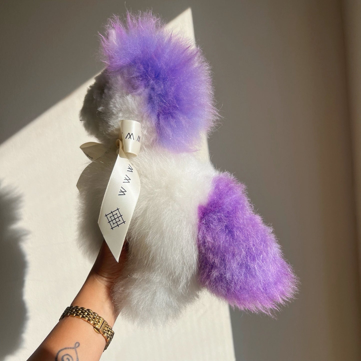 Alpaca wool unicorn plushie gift or home decoration. 100% baby  
alpaca wool. Handmade by Bolivian and Peruvian artisans. Purple stuffed unicorn