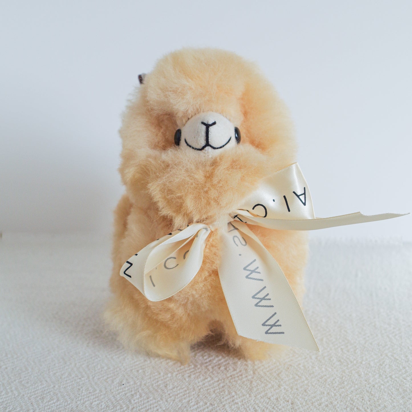 Home decor or gift soft beige llama plushies. 100% alpaca wool plushies. Made by Bolivian and Peruvian artisans. Chibi cute llama toy