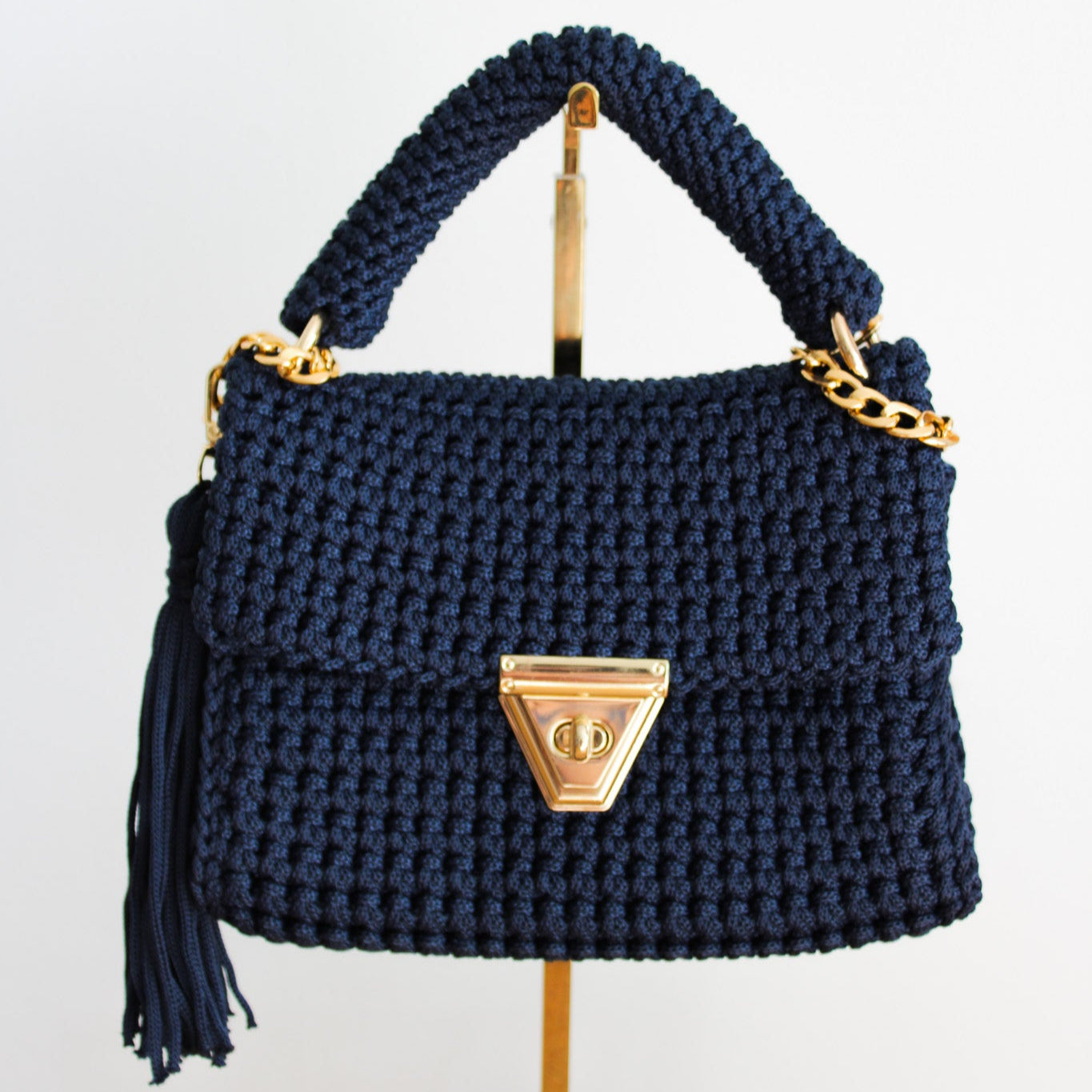 Handmade crochet navy blue purse. Handbag with crochet texture and gold details. Gold chain for crossbody or shoulder bag style. Made by hand