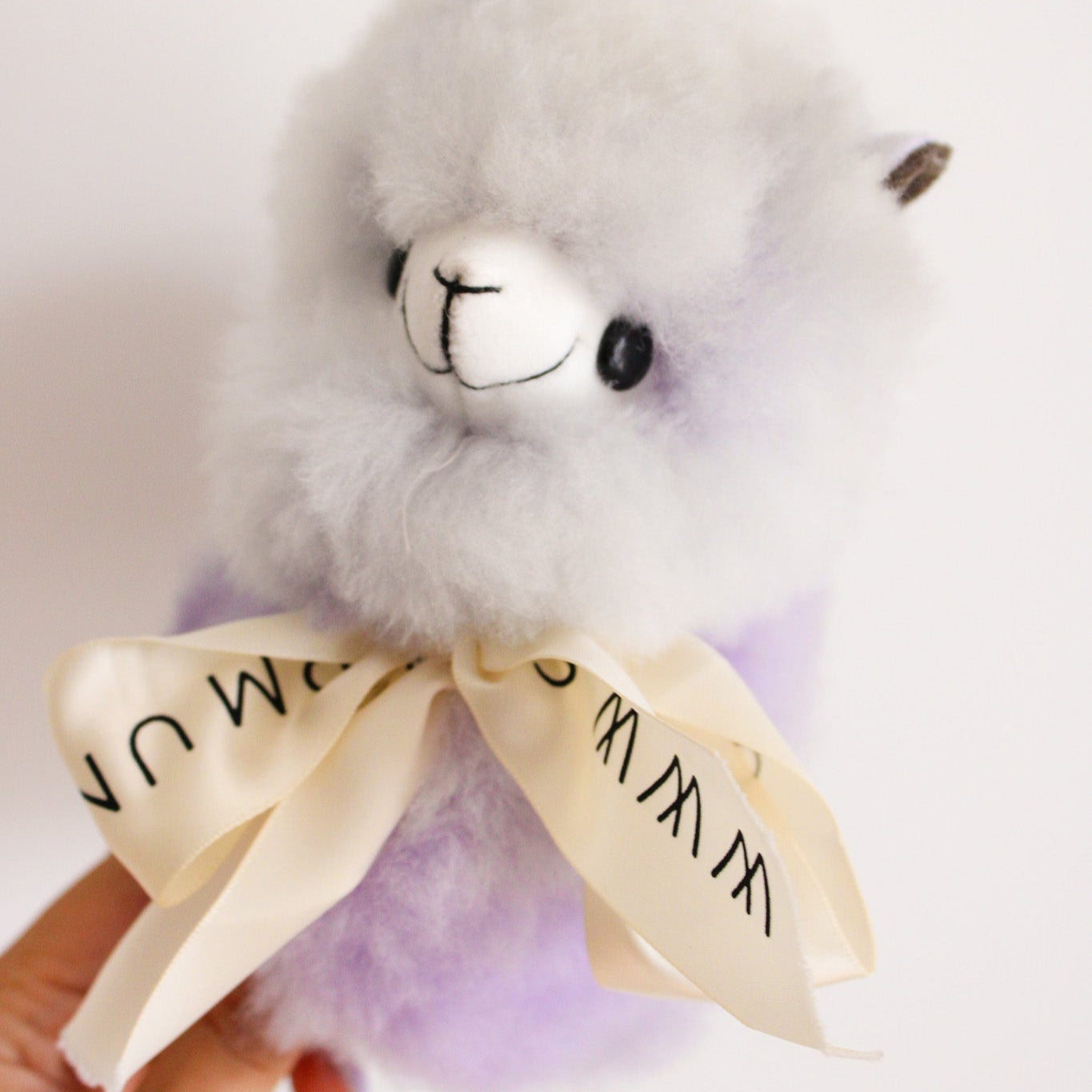Home decor or gift soft beige llama plushies. 100% alpaca wool plushies. Made by Bolivian and Peruvian artisans. Chibi cute super fluffy pink llama toy