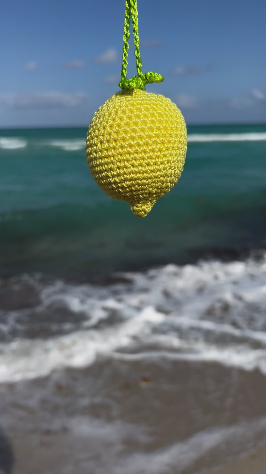Bright and cheerful lemon accessory for bags or backpacks.  Crocheted by hand with soft, durable yarn and finished with a green crochet leaf detail. Handmade amigurumi crochet fruits.