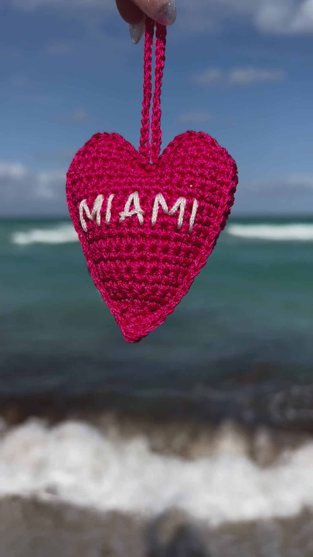 Crochet handmade miami heart charm bag. Make your bag look stylish and cute. Hot pink handmade charm for bags. Bright and cheerful accessory for bags or backpacks.  Crocheted by hand with soft, durable yarn and finished with embroidery. Perfect travel souvenir MIAMI Handmade amigurumi crochet heart.