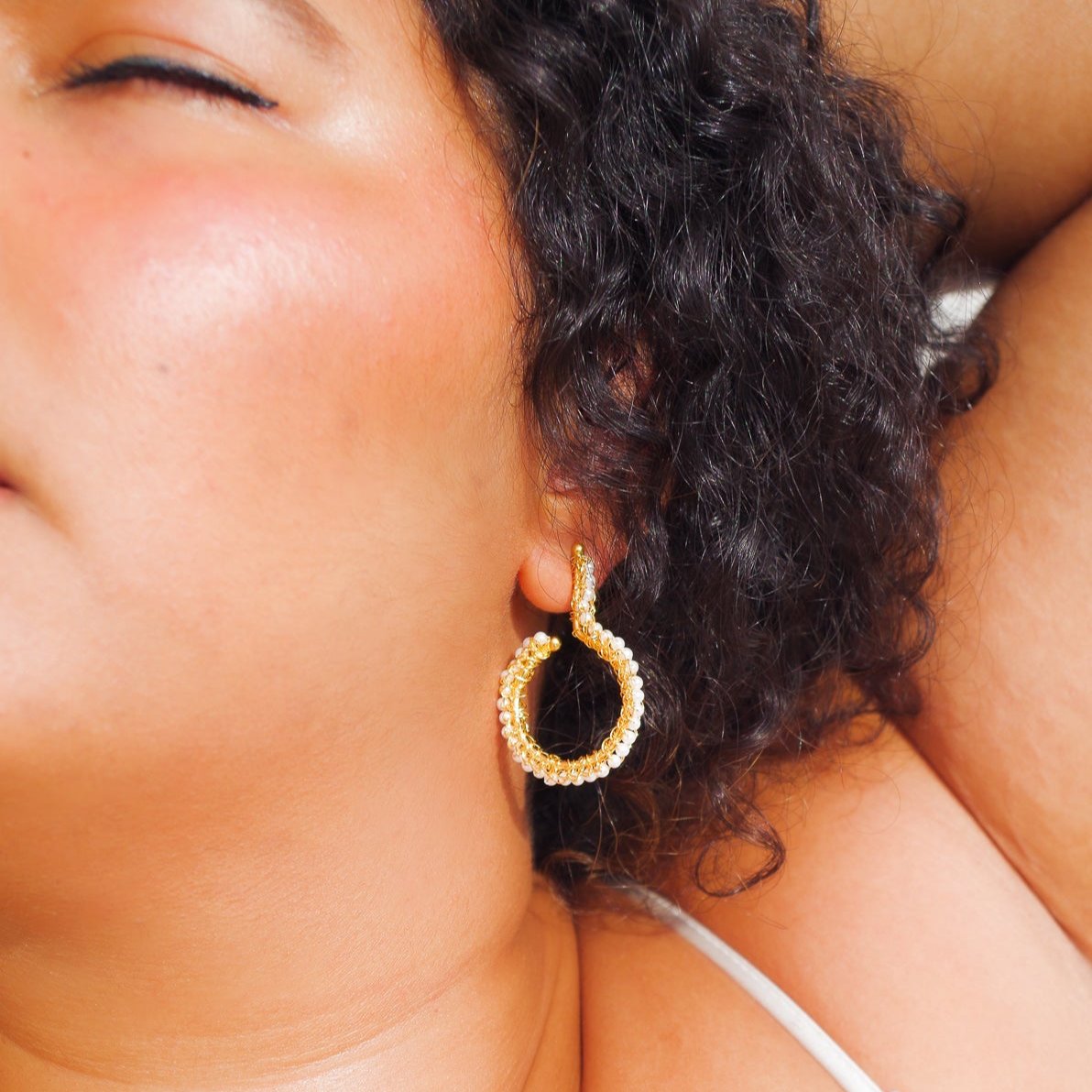 Crochet beaded geometric hoop earrings. 18 karat gold filled copper wire. Super lightweight earrings with white beads