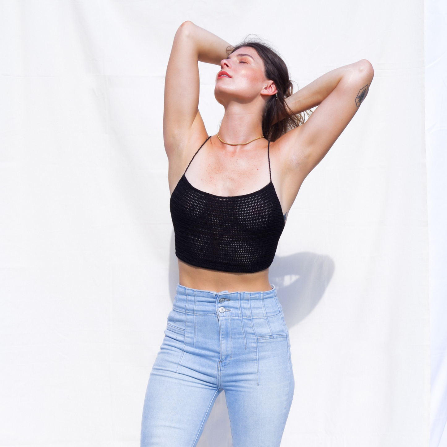 Crop top with spaghetti straps and an open back. Hand made with our signature silk ribbons. One size fits S - L