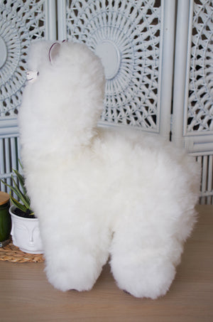 Alpaca wool plushie for home decor or gift. Large size 20" in. Made with 100% alpaca wool. Madeby bolivia and Peruvian artisans. Colors Available: pink, white, beige, gray, lilac. Adult or children gift