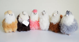 Alpaca wool plushie for home decor or gift. Small size 6" in. Made with 100% alpaca wool. Made by Bolivian and Peruvian artisans. Colors Available: pink, white, beige, gray, purple. Adult or children gift