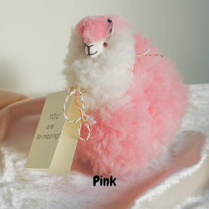 Alpaca wool plushie for home decor or gift. Small size 6" in. Made with 100% alpaca wool. Made by Bolivian and Peruvian artisans. Colors Available: pink. Adult or children gift