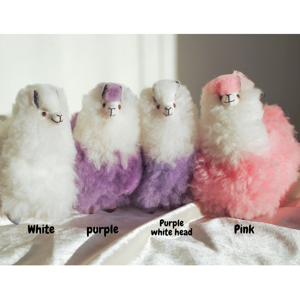 Alpaca wool plushie for home decor or gift. Small size 6" in. Made with 100% alpaca wool. Made by Bolivian and Peruvian artisans. Colors Available: pink, white, purple. Adult or children gift
