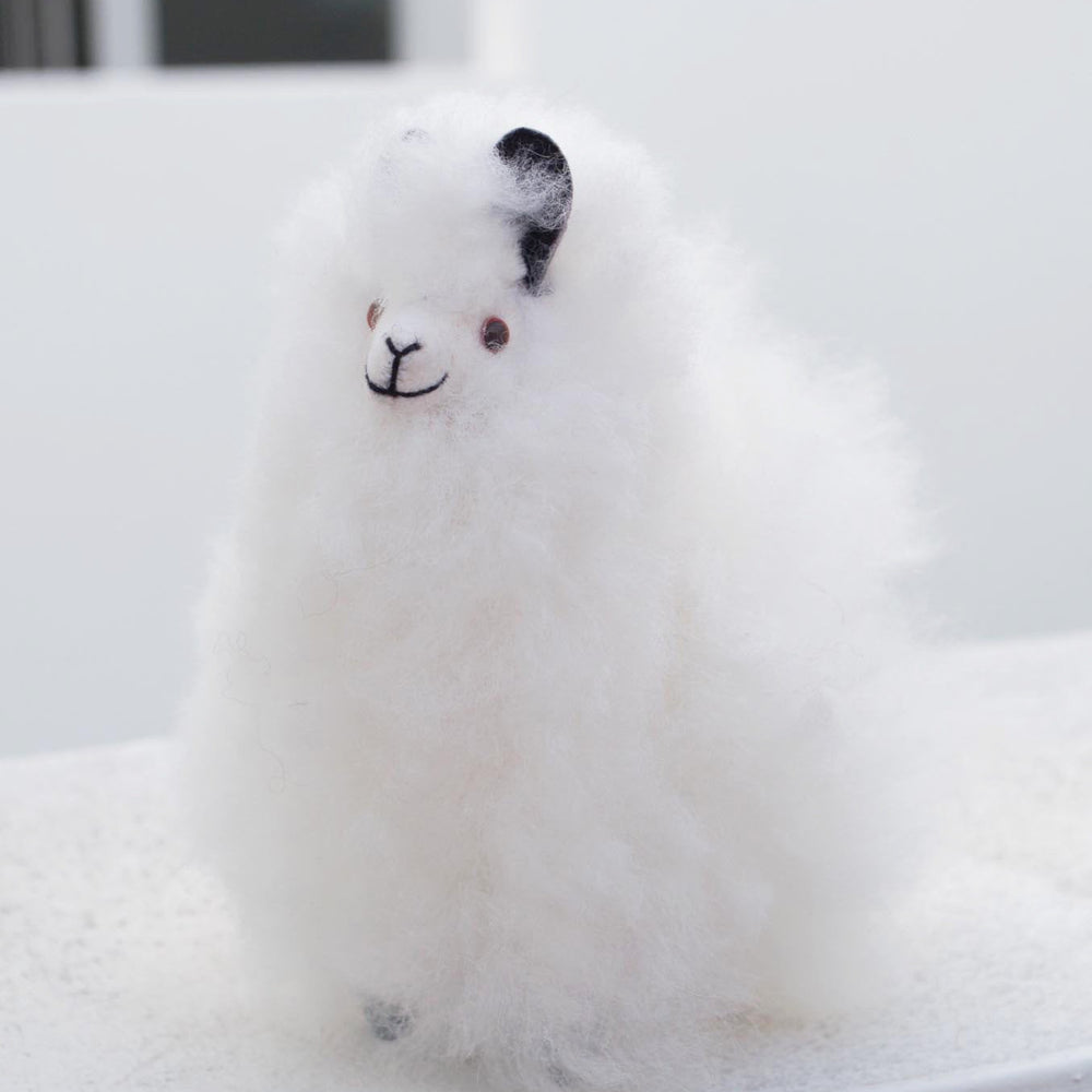 
                      
                        Alpaca wool plushie for home decor or gift. Small size 6" in. Made with 100% alpaca wool. Made by Bolivian and Peruvian artisans. Colors Available: white. Adult or children gift
                      
                    