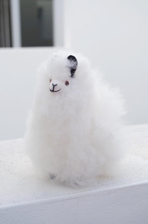Alpaca wool plushie for home decor or gift. Small size 6" in. Made with 100% alpaca wool. Made by Bolivian and Peruvian artisans. Colors Available: white. Adult or children gift