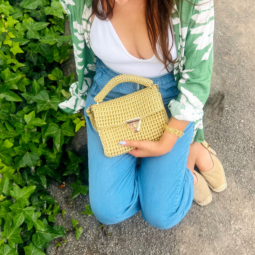 
                      
                        Handmade crochet lime green amber bag. Textured crochet lime green bag with gold detailing and gold chain for crossbody look. 
                      
                    