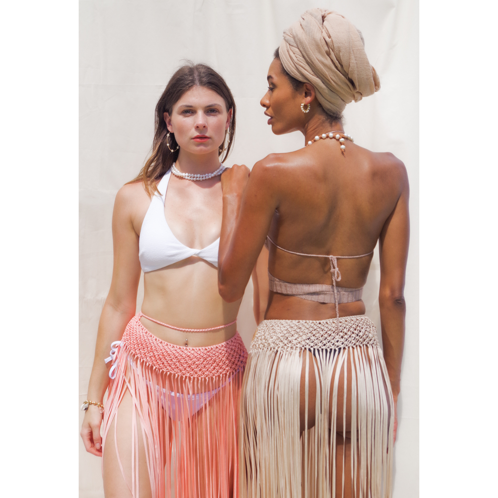 
                      
                        Anya Macrame Skirt or Beach Cover Up with tassels. One size fits all. Weaving width: 3" in Fringe length: 26" in approx. Tie Closure. Colors: Beige, Caramel, Black, Gold, Dusty Pink or Sage Green. Ethically made in Bolivia
                      
                    