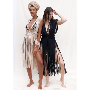 
            
                Load image into Gallery viewer, Black and Beige macrame dress for festival or beach vacation. Wrap tie closure at shoulders and waist. Care instructions: Steam to straighten any wrinkles. Ethically made by Bolivian Artisans. 100% Rayon. Colors available: Beige, Black, Gold.
            
        