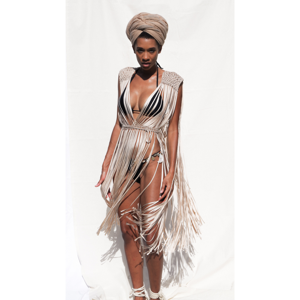 Beige boho macrame dress for festival or beach vacation. Wrap tie closure at shoulders and waist. Care instructions: Steam to straighten any wrinkles. Ethically made by Bolivian Artisans. 100% Rayon. Colors available: Beige, Black, Gold.