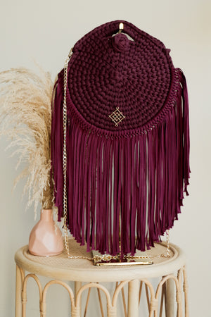 Burgundy Rounded crossbody bag with fringes and chain strap. Made with crochet and macrame techniques. Boho Style. Color: Burgundy. Includes lining and zipper. Handmade in Bolivia. Hand Wash and professional cleaning only. 100% Rayon