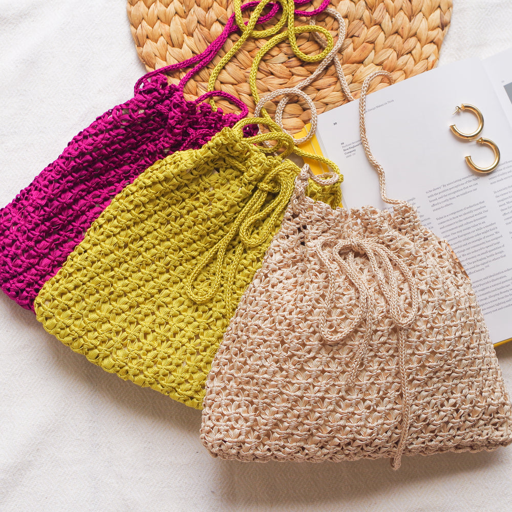 Handmade purse. Crochet strap, Fully lined, includes pockets. Drawstring crochet bag perfect for traveling. 