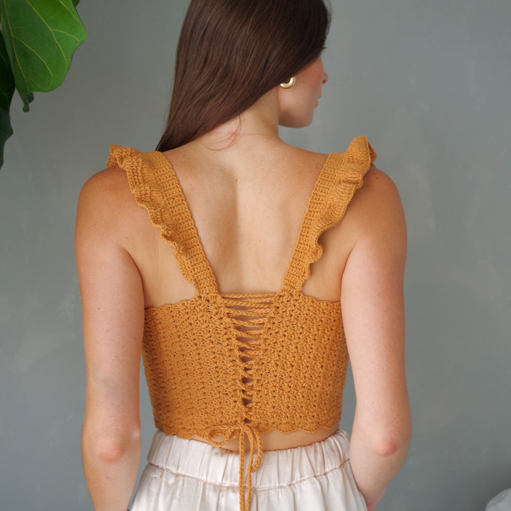
                      
                        Handmade crochet corset top. 100% cotton with ruffled sleeves, square neckline.
                      
                    
