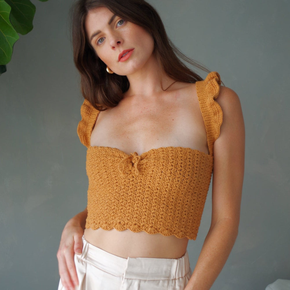 
                      
                        Handmade crochet corset top. 100% cotton with ruffled sleeves, square neckline.
                      
                    