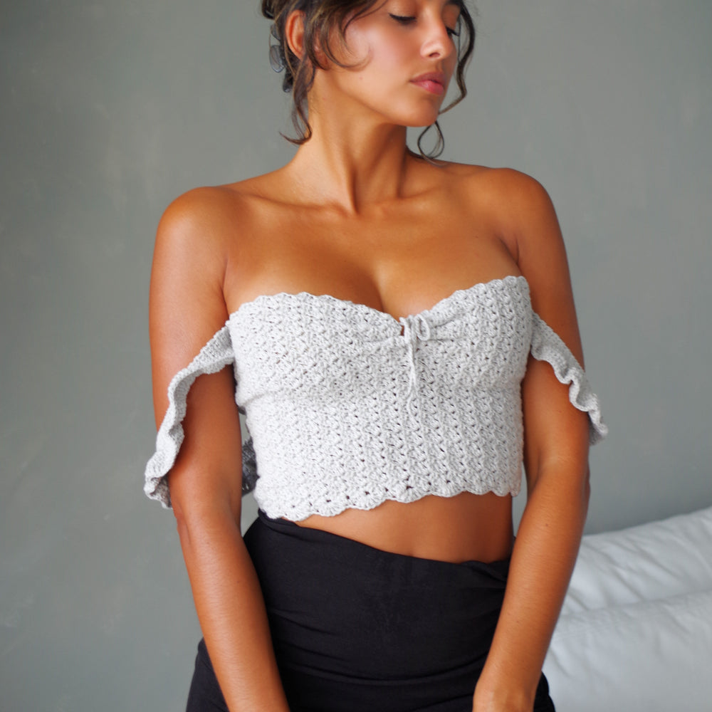 
                      
                        Handmade crochet corset top. 100% cotton with ruffled sleeves, square neckline.
                      
                    