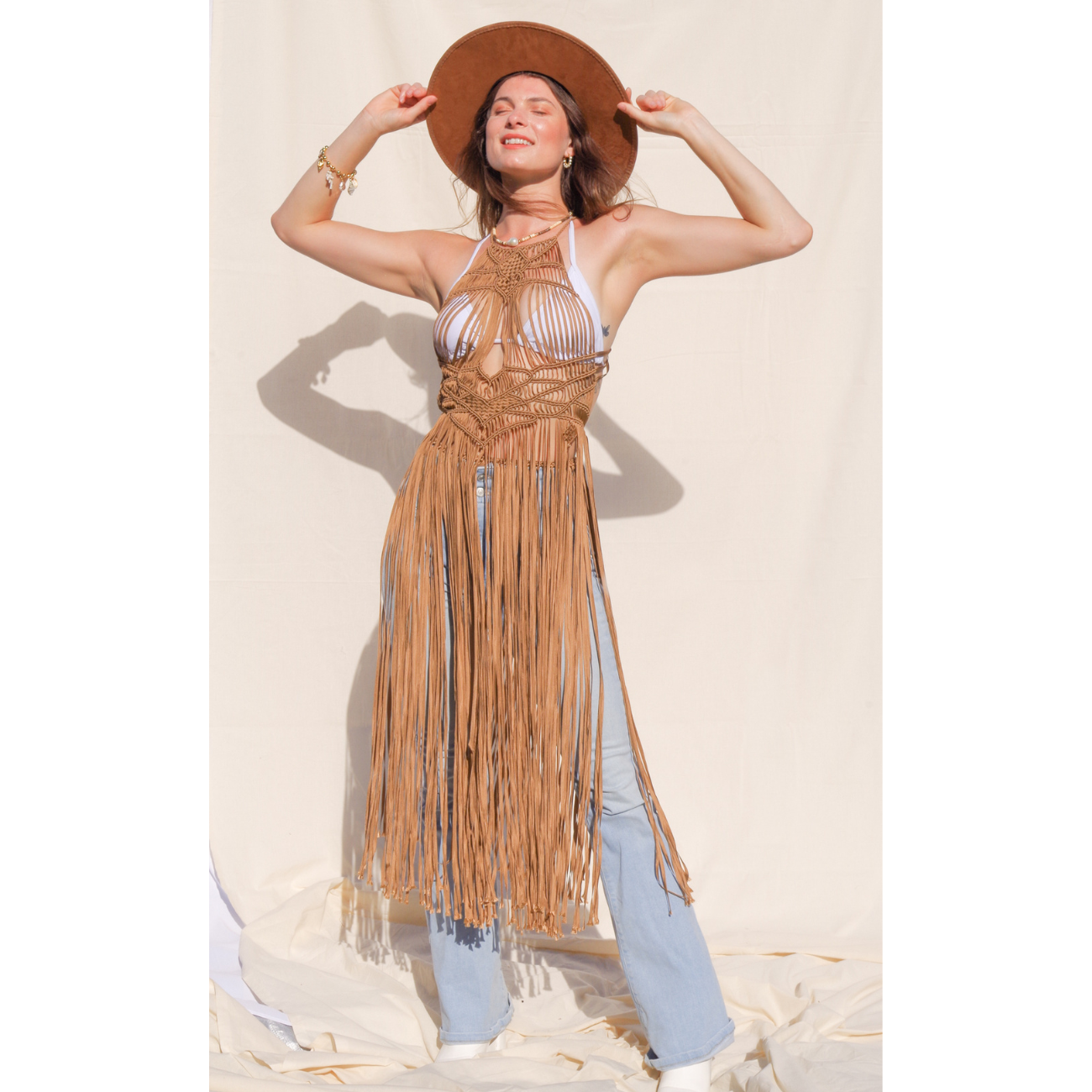 Luna Beige Macrame Dress (one size fits S - XL) Macrame beach cover up or fashion accessory. Halter Top and Wrap Dress closure. Colors available: Beige, Gold, Caramel, Brown. Care instructions: Steam to straighten any wrinkles. Dry clean or gentle hand wash. 100% rayon. Ethically made by Bolivian artisans.