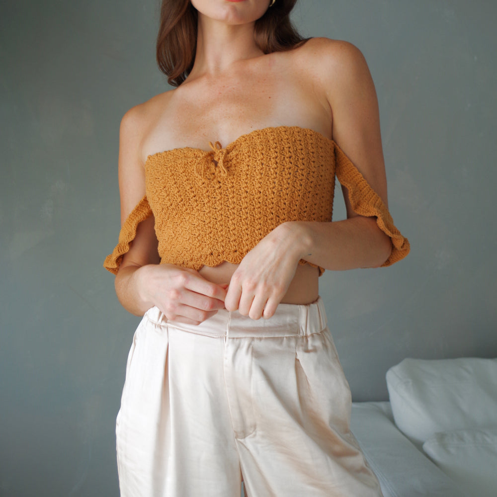 
                      
                        Handmade crochet corset top. 100% cotton with ruffled sleeves, square neckline.
                      
                    