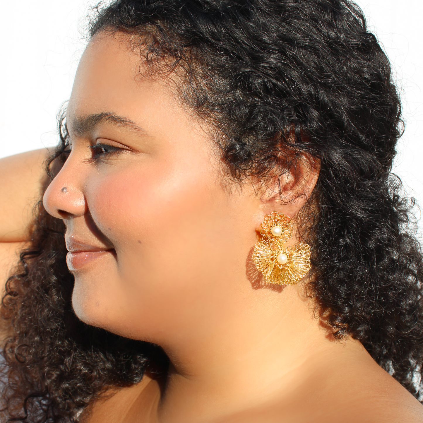 Handmade multi layered crochet dangle earrings. Post and clip long earrings with pearls on every layer. Shiny gold wire ruffled dangle earrings. 