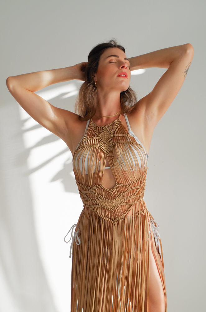 
            
                Load image into Gallery viewer, Luna_Macrame_Dress_Beach_Cover_Up_for_Women_chest_view_detail  2048 × 2048px  Luna Macrame Dress (one size fits S - XL) Macrame beach cover up or fashion accessory. Halter Top and Wrap Dress closure. Colors available: Beige, Gold, Caramel, Brown. Care instructions: Steam to straighten any wrinkles. Dry clean or gentle hand wash. 100% rayon. Ethically made by Bolivian artisans.
            
        