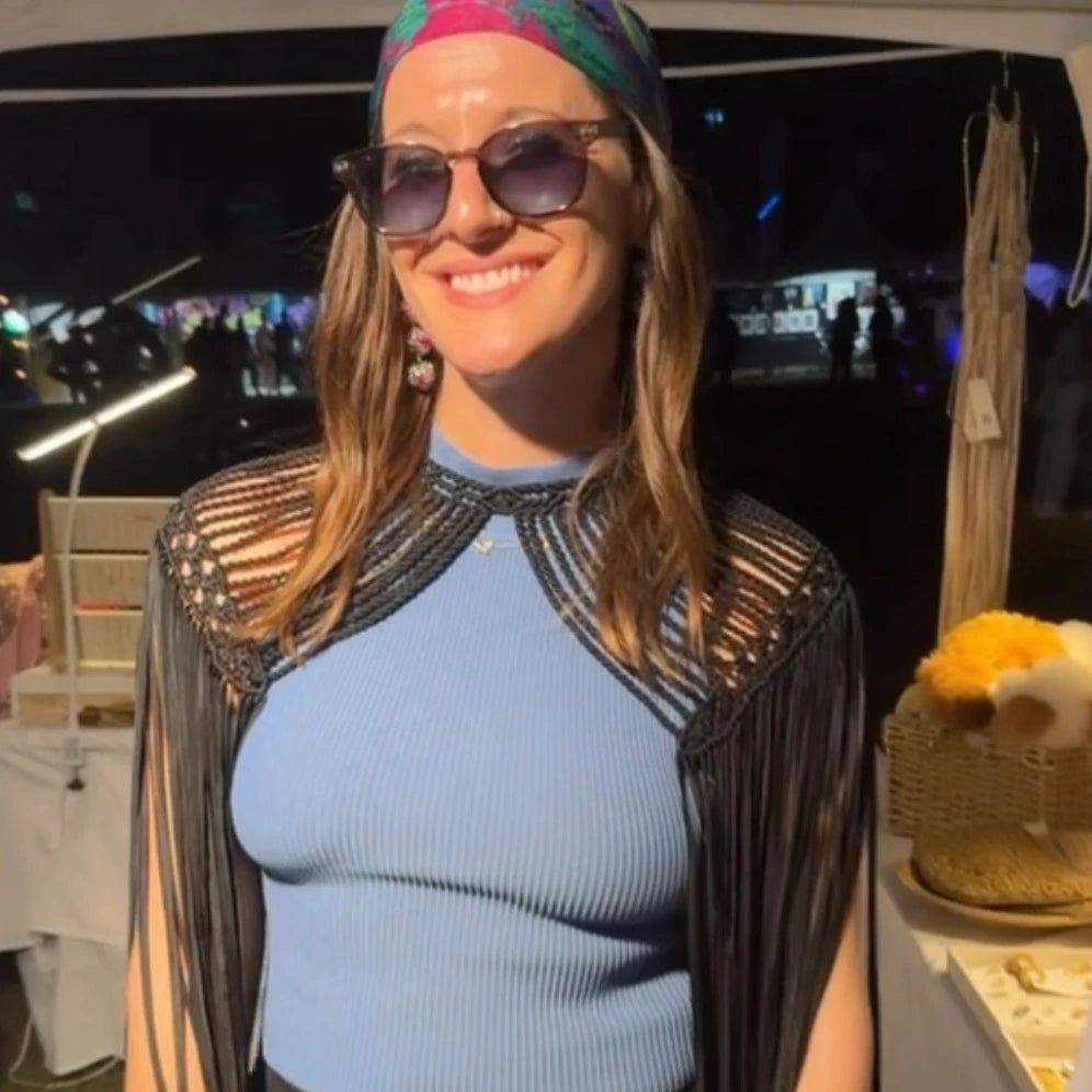 Women wearing leia fringed shoulder accent on a festival setting