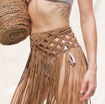 Caramel Marina Macrame Beach Skirt or Belt Beach Cover Up with tassels. Weaving width: 6" in Fringe length: 26" in approx. Tie Closure. Handmade in Bolivia. Handwash only