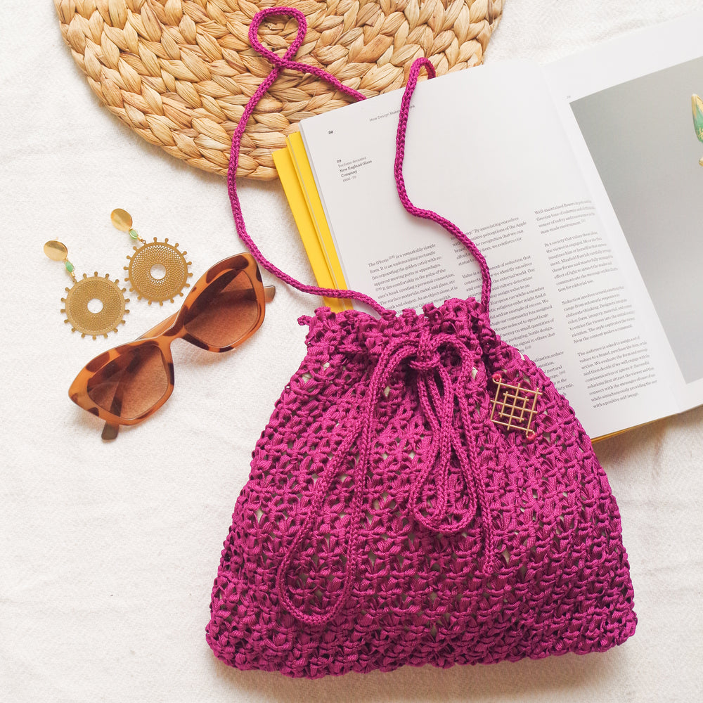 
                      
                        Handmade purse. Crochet strap, Fully lined, includes pockets. Drawstring macrame bag perfect for traveling. 
                      
                    