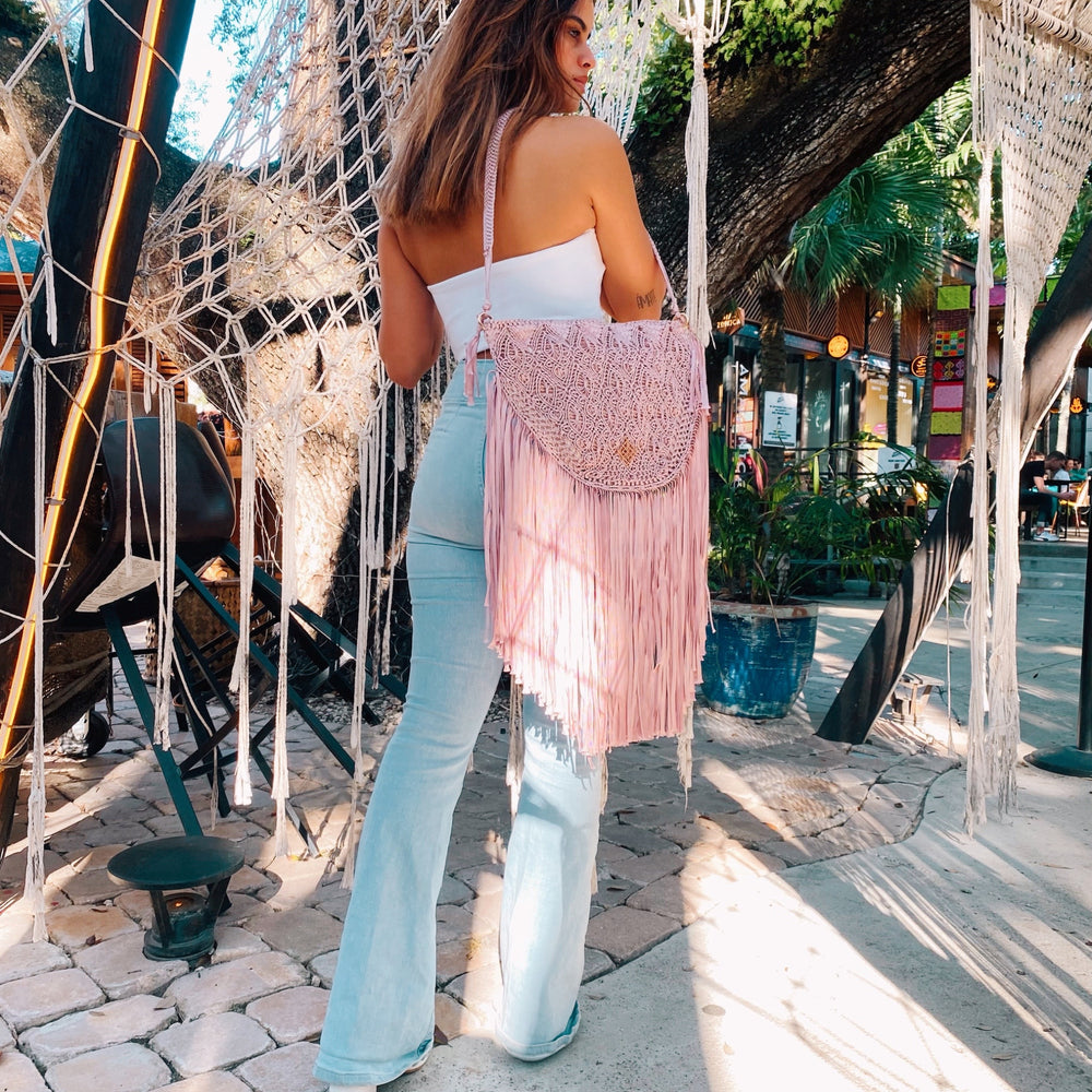 
                      
                        Pink Macrame crossbody bag with fringes. Includes lining and zipper. Handmade in Bolivia. Hand Wash and professional cleaning only. 100% Rayon
                      
                    