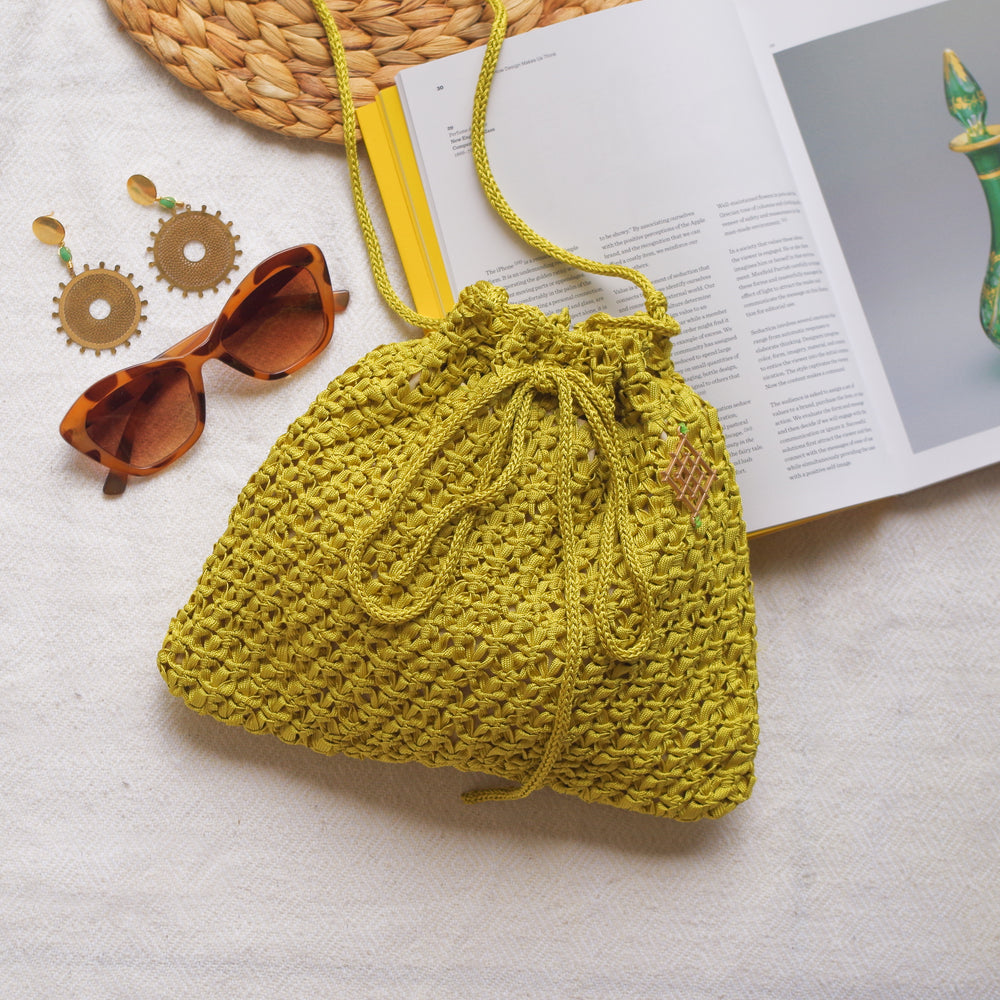 
                      
                        Handmade purse. Crochet strap, Fully lined, includes pockets. Drawstring crochet bag perfect for traveling. 
                      
                    