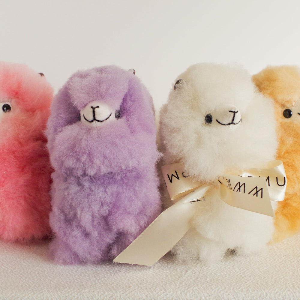 
                      
                        Home decor or gift soft llama plushies. 100% alpaca wool plushies. Made by Bolivian and Peruvian artisans. Colors available: Pink, Beige, White, Gray. Sizes: 8 x 8 in"
                      
                    