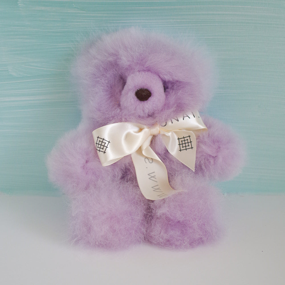 Alpaca wool teddy bear plushie gift or home decoration.100% baby alpaca wool. Dimensions are approx.: 8 1/2” x 8 1/2” Available in colors: Beige and white. Handmade by Bolivian and Peruvian artisans.