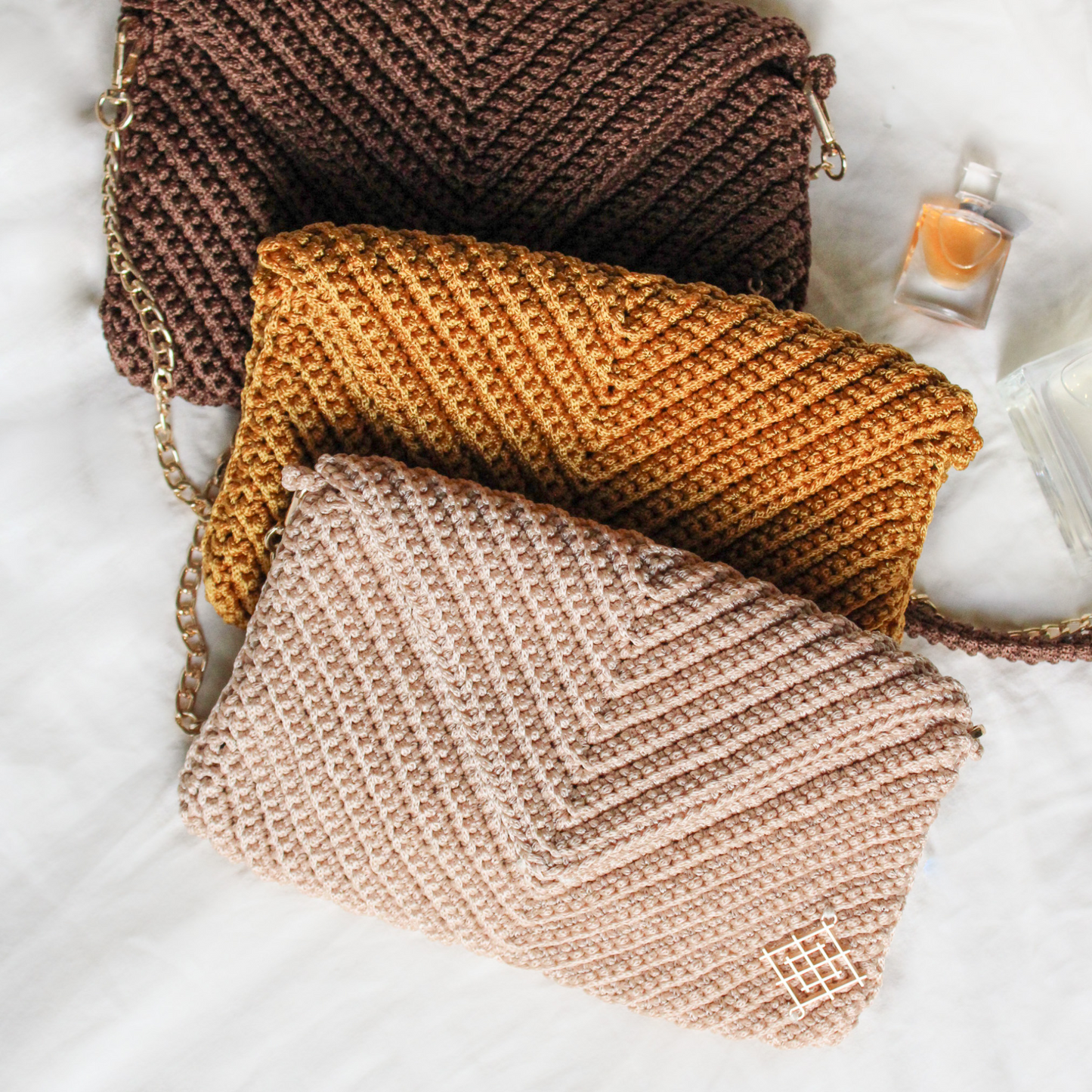 Handmade envelope bags in beige, gold and chocolate brown