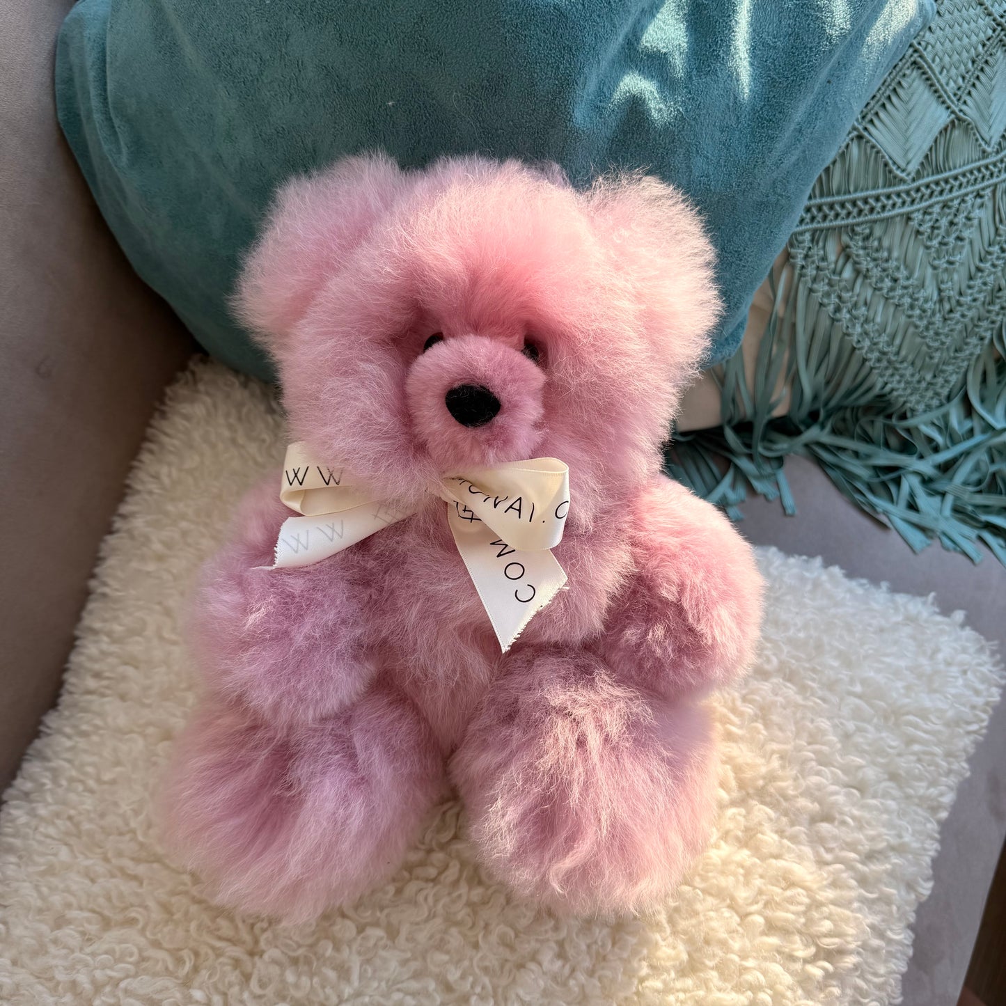 Authentic alpaca fur fluffy teddy bear lilac plushie with white bow. Light purple teddy bear