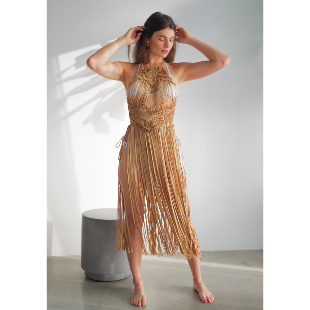 
                      
                        Luna caramel Macrame Dress (one size fits S - XL) Macrame beach cover up or fashion accessory. Halter Top and Wrap Dress closure. with fringe skirt Colors available: Beige, Gold, Caramel, Brown. Care instructions: Steam to straighten any wrinkles. Dry clean or gentle hand wash. 100% rayon. Ethically made by Bolivian artisans.
                      
                    
